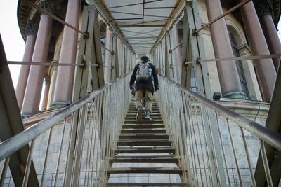 Low angle view of woman standing on steps