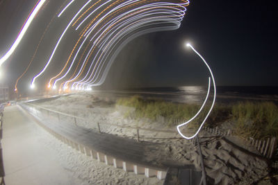 Light trails in sky at night