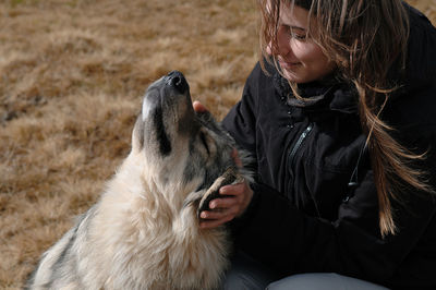 Full length of woman with dog