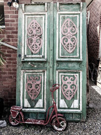 Graffiti on closed door of old building