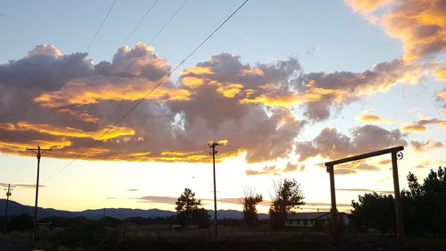 Low angle view of silhouette trees against sky during sunset