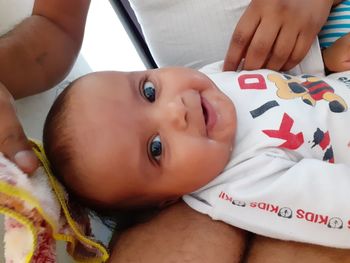 High angle portrait of cute baby lying