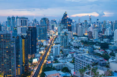 Aerial view of modern buildings in city against sky