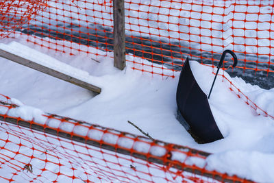 High angle view of snow covered umbrella