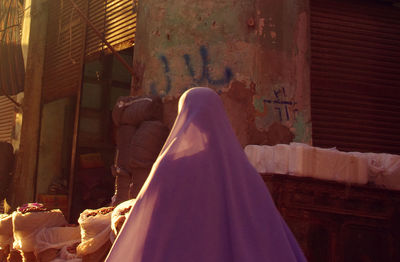 Low section of people against building