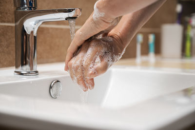 Midsection of woman in bathroom