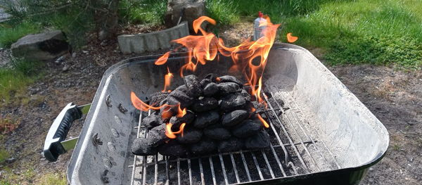 High angle view of bonfire on barbecue grill