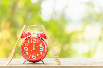 Close-up of clock on table