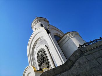 Low angle view of traditional building against clear blue sky