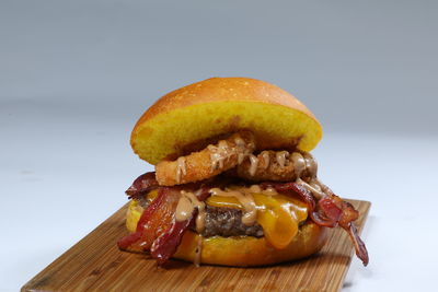 Close-up of burger against white background