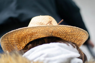 Rear view of a woman wearing hat