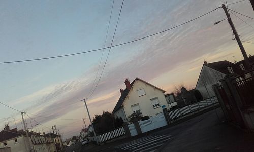 Panoramic view of buildings and trees against sky