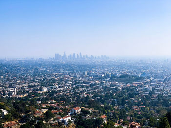 High angle view of city buildings against clear sky