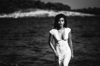 Portrait of young woman in sea