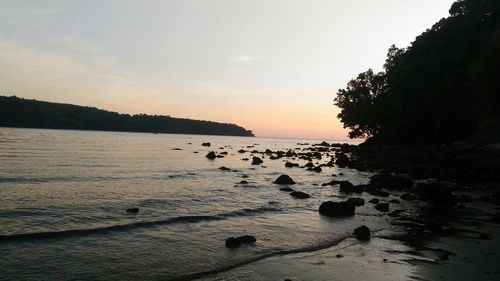 Scenic view of sea against sky at sunset