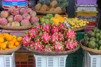 Fruits such as dragon fruit, mango, pineapple, tangerine, orange, watermelon, tamarind are sold