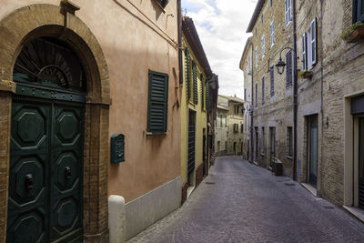 Narrow street amidst buildings in town