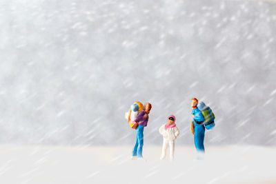 High angle view of figurines on snow