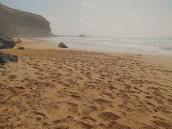 Scenic view of beach against sky