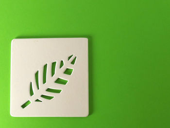 Close-up of design over green background