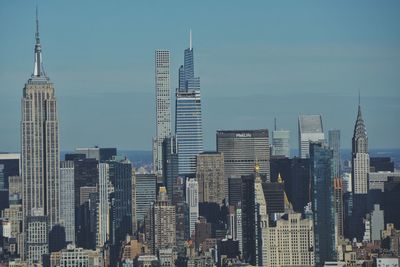 Modern buildings in city against sky