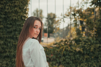 Portrait of woman standing outdoors