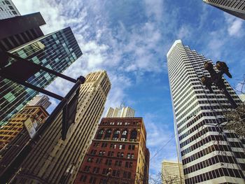 Low angle view of modern buildings against sky