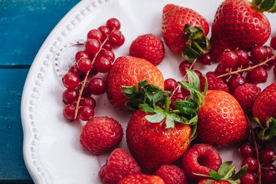 High angle view of strawberries in bowl on table