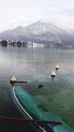 Scenic view of water with mountains in background