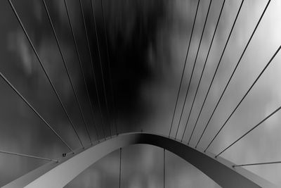 Low angle view of suspension bridge against sky