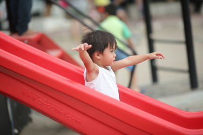Cute boy looking away in playground