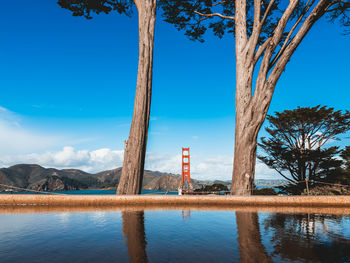 Scenic view of lake against clear blue sky