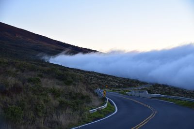 Scenic view of mountain road against sky