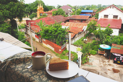 High angle view of coffee and buildings on table