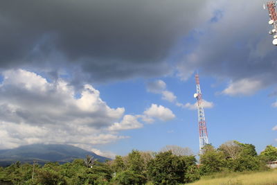 Low angle view of communications tower against sky