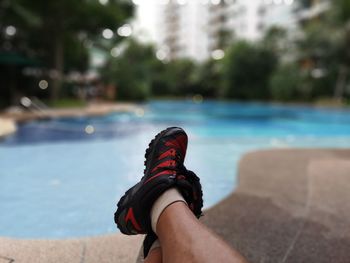 Low section of person in swimming pool