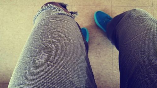 Close-up of shoes on tiled floor