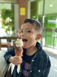 Portrait of boy eating ice cream cone