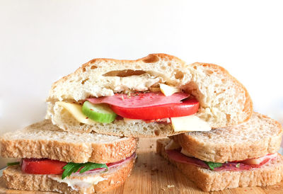Close-up of bread on cake against white background