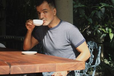 Close-up of a man drinking coffee cup