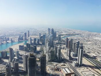 High angle view of buildings in city against sky