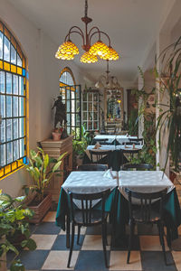 Empty chairs and tables in restaurant