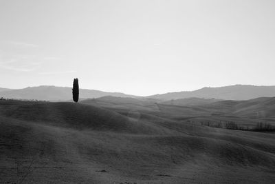 Scenic view of arid landscape against sky