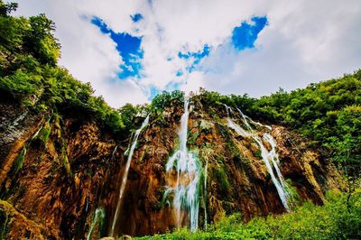 Scenic view of landscape against cloudy sky