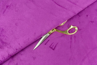 High angle view of scissors and textile