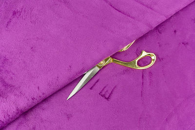 High angle view of heart shape on purple wall