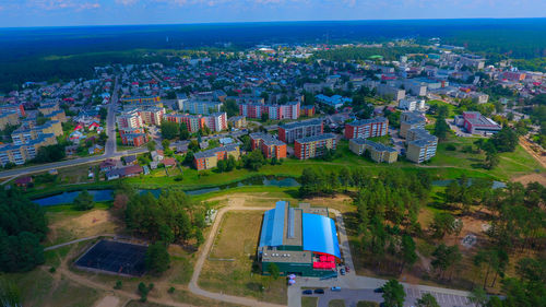 High angle view of trees and buildings in city