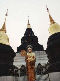 Low angle view of statue of building against sky