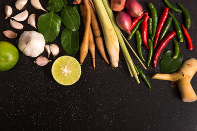 Close-up of various vegetables over black background