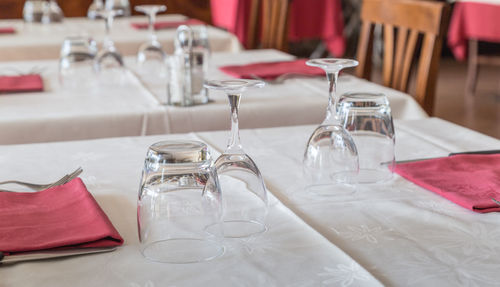 Empty glasses on table in restaurant